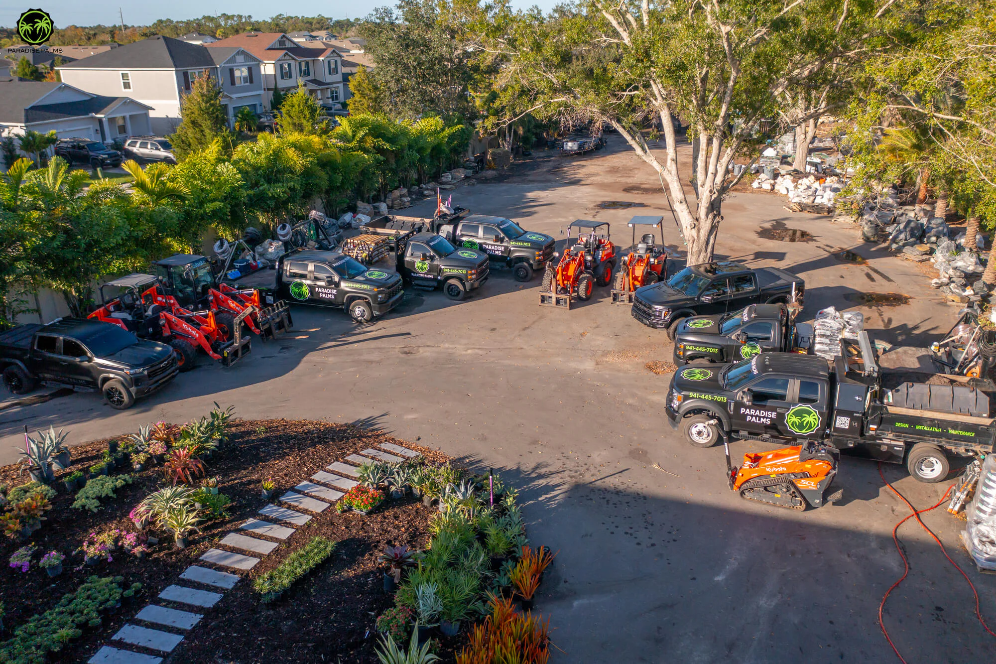 Paradise Palms landscaping team equipment and trucks for Lakewood Ranch outdoor projects.
