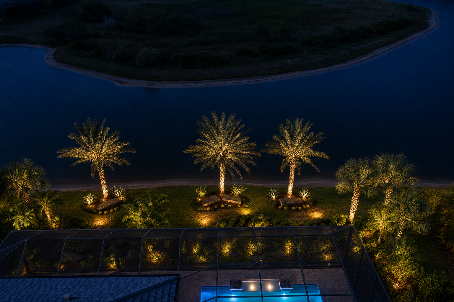 Landscape lighting Lakewood Ranch home with path lights and palm uplighting